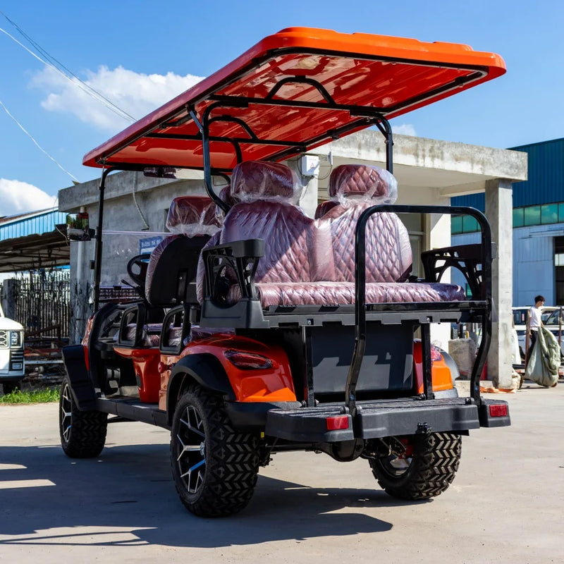 Voiturette de golf électrique 4 places orange – vue arrière avec banquette rabattable