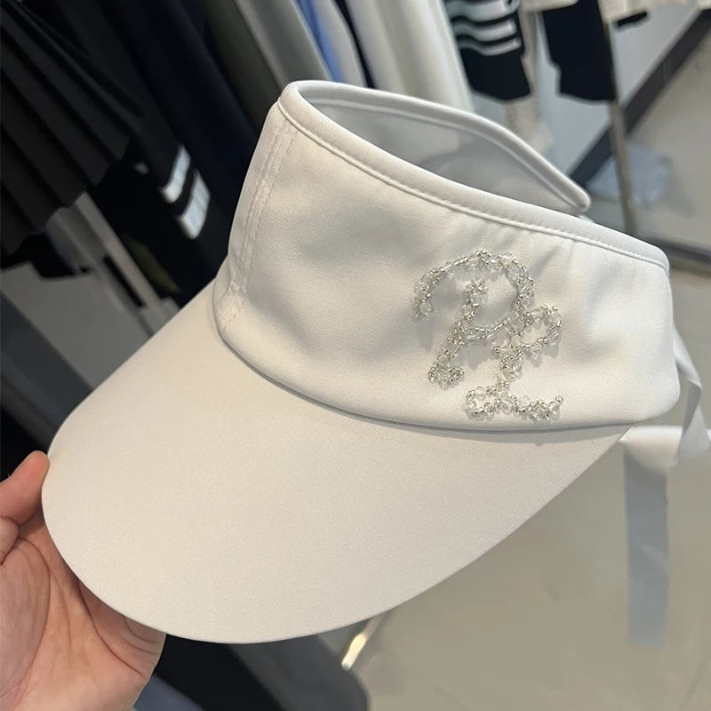 Visière de golf femme à monogramme perlé – coloris blanc