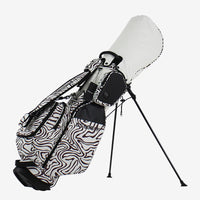 Sac de golf trépied léger à motif animalier – sac blanc à motif zébré debout sur son trépied, fond uni