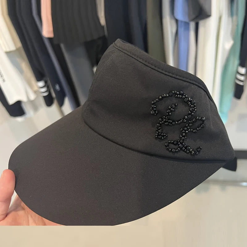 Visière de golf femme à monogramme perlé – coloris noir