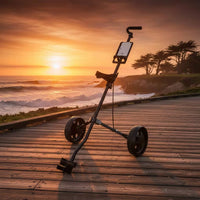 Chariot de golf manuel pliable à 2 roues – vue de trois quarts au coucher du soleil