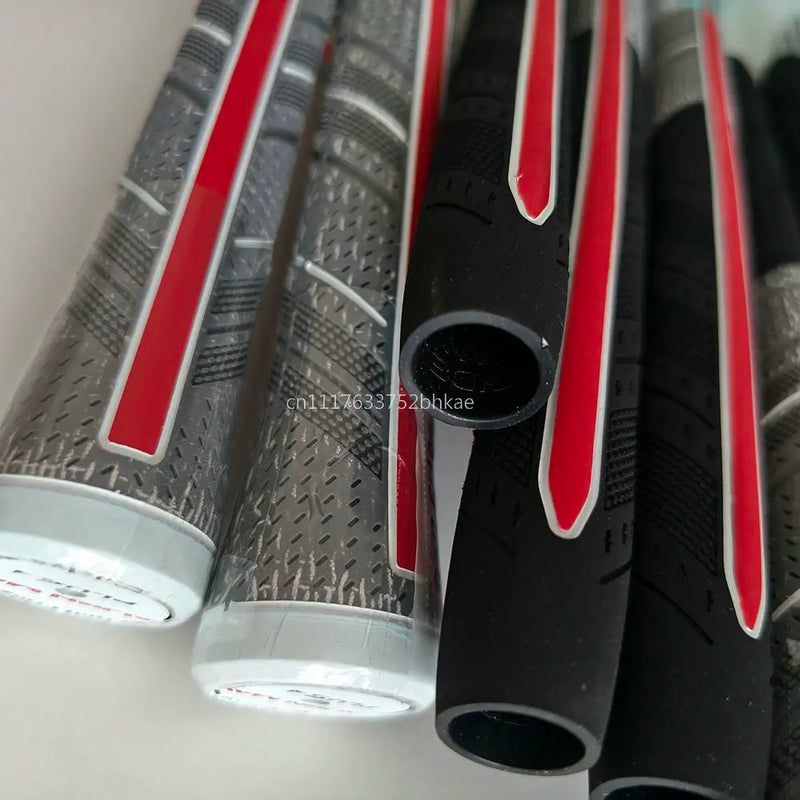 Grips de golf demi-coton – grips à bande rouge posés les uns sur les autres