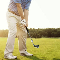 Aide au swing rétractable – golfeur à l'adresse avec l'aide au swing en main